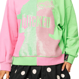Licensed Green & Pink Colorblock Character Profile 'Wicked' SweatshirtWomens - Tops - Sweatshirts & PopoversQueen of SparklesThe Printed Peach Savannah