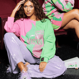Licensed Green & Pink Colorblock Character Profile 'Wicked' SweatshirtWomens - Tops - Sweatshirts & PopoversQueen of SparklesThe Printed Peach Savannah