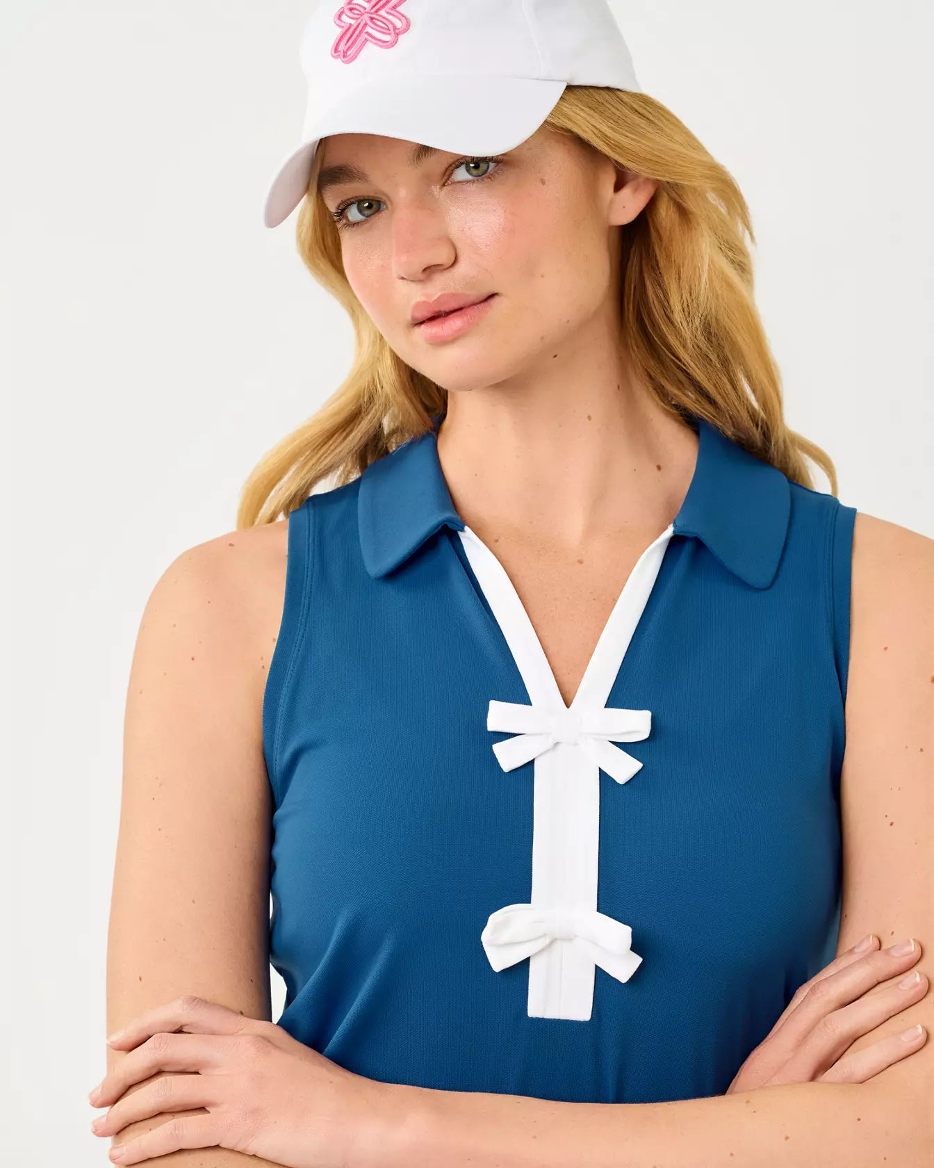 UPF 50+ Luxletic Frida Sleeveless Bow PoloWomen - Active - Active Tops - PolosLILLY PULITZERThe Printed Peach Savannah